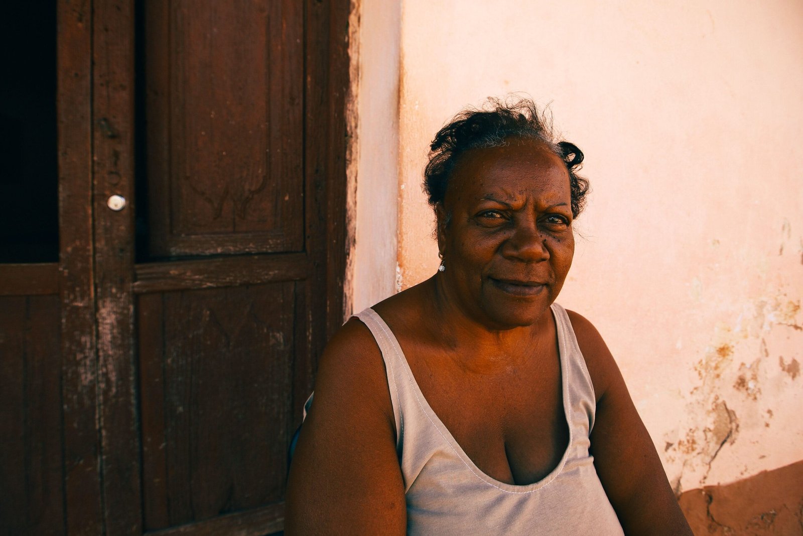 Older Caribbean woman enjoying a peaceful moment outdoors