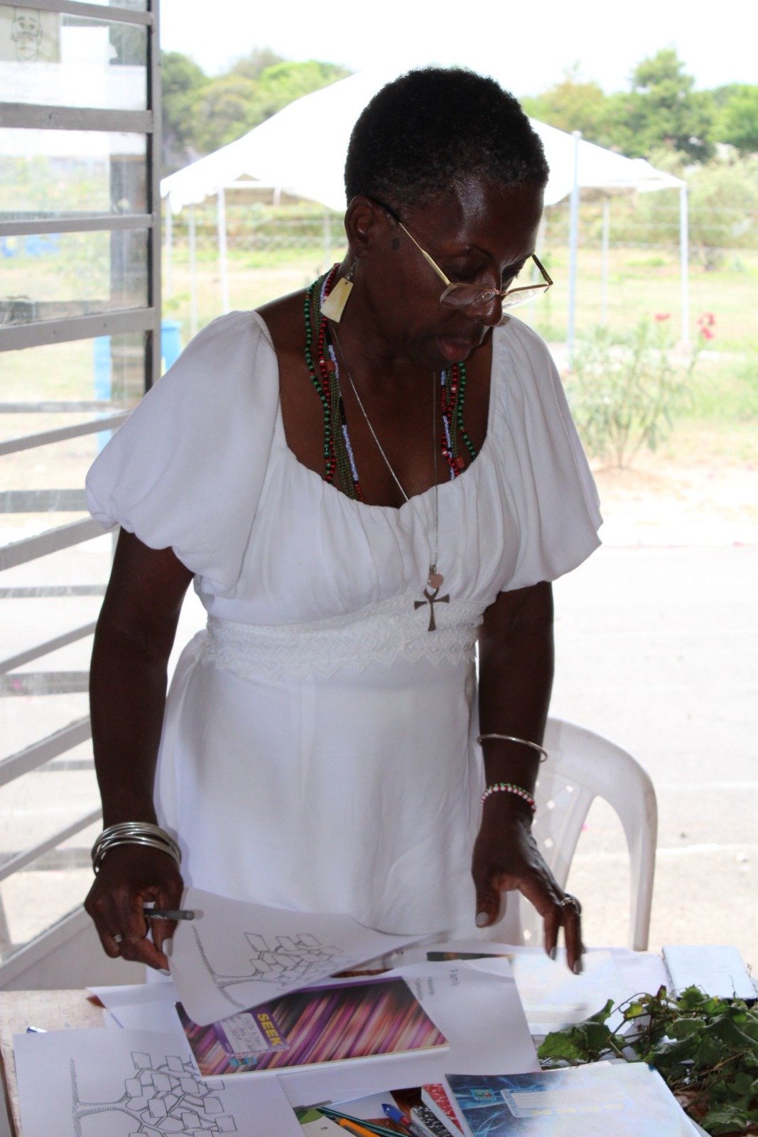 An older woman participating in an online wellness session